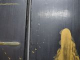 a picture of a woman that is standing in front of a door