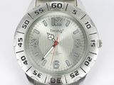 a close up of a wrist watch on a white surface