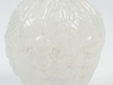 a white vase that is sitting on a white surface