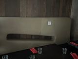 a long table with glasses on it in a restaurant