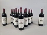 six bottles of wine are lined up in a row on a table
