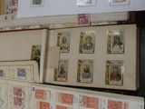 a lot of stamps on a shelf with a lot of them