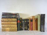 a lot of books that are stacked on top of each other