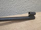 a close up of an old gun on a burlock cloth