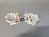 two figurines that are sitting on a table