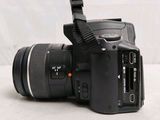 a close up of a camera with a lens attached to it