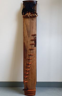 a tall wooden pole with a clock on top of it