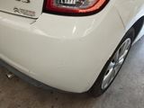 a white car that is parked in a garage