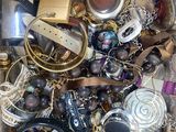 a box full of assorted jewelry and other items