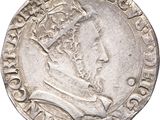 a close up of a coin with a crown on it
