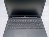 an open laptop computer sitting on top of a white table