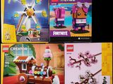 four legos of different designs are displayed on a black background