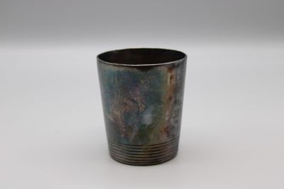a cup that is sitting on a white surface