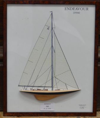 a framed picture of a sailboat on display in a frame