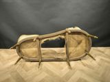 an old wooden bench sitting on top of a wooden floor