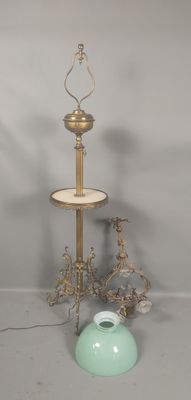 a three tiered table with a vase and a lamp