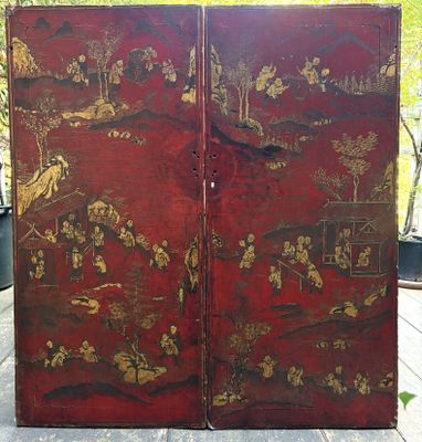 a large red screen with gold designs on it