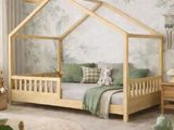 a bed with a wooden frame in the middle of a room