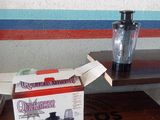 a box of food sitting on a table next to a blender