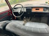 a dashboard and steering wheel in this old car