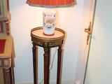 a lamp that is sitting on a table in a room