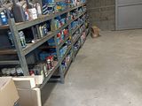 a room with a lot of shelves and boxes on the floor