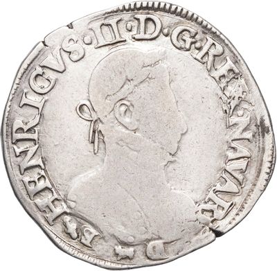 Gros plan sur une pièce de monnaie portant le visage d'un homme
