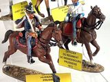 many figurines of soldiers on display in a display case