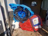 a blue bag and a red bag in the back of a truck