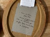 a piece of paper on a plate with a piece of paper on it