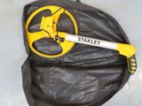 a yellow and black bag with a yellow wheel on it