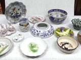 a table with a lot of different bowls and plates on it
