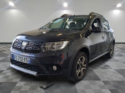 a picture of a grey dacia parked in a garage