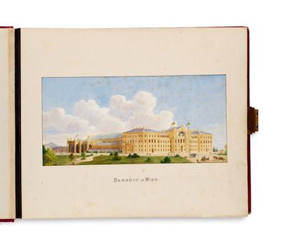 an open book with a picture of a large building in the background