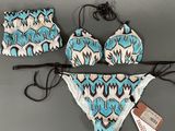 two pieces of swimsuit with a blue and white pattern on it