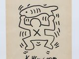 a black and white drawing of two people hugging each other