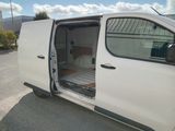 a white van that is parked in a parking lot