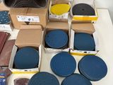 many different types of sanding discs and discs on the table