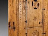 an image of a wooden cabinet with a door and a window