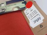 a card with a price tag attached to a mannequin ' s head