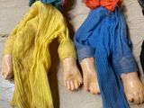 three dolls that are sitting on a table