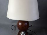 lamp in the shape of a sphere with a wooden base and a white shade