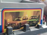 a picture of two cars on the back of a train
