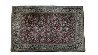 a red and blue rug on a white background