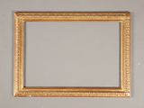 an old picture frame on a wall with a white background