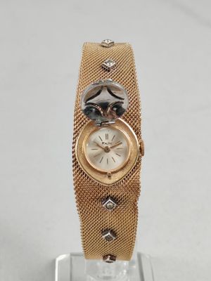 MAJIC. MONTRE BRACELET BIJOU en plaqué or et pierres blanche…