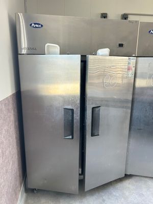 stainless steel refrigerators in a commercial kitchen next to each other