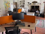 an image of a home office with a desk and two monitors