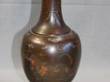 two vases sitting next to each other on a table