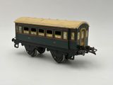 a toy train on a white surface with a white background